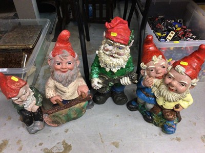 Lot 407 - Four painted plastic garden gnomes