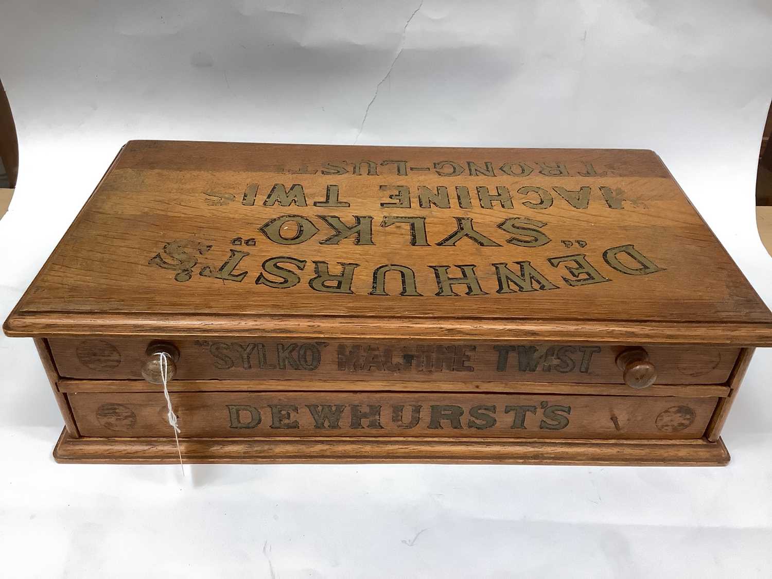 Lot 2546 - Edwardian oak 'Dewhurst's "Sylko" Machine twist' sewing thread shop display box