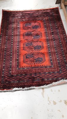 Lot 1019 - Afghan rug with blue decoration on red ground