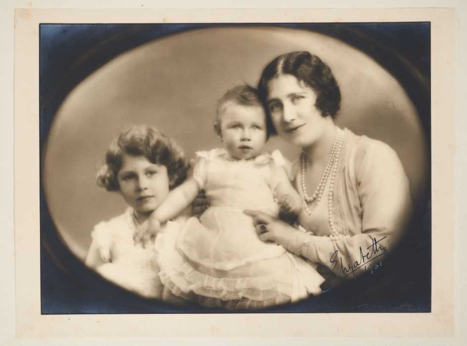 Lot 21 - H.R.H. Elizabeth Duchess of York (later H.M.Queen Elizabeth The Queen Mother) charming 1930s signed portrait photograph of the Princess with her infant daughter Margaret and five year old...
