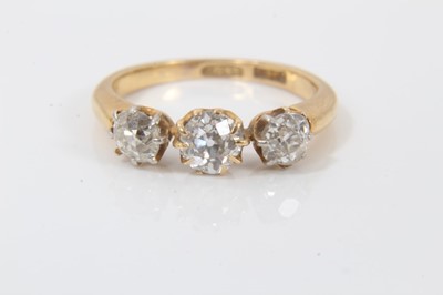 Lot 629 - 18ct gold diamond three stone ring