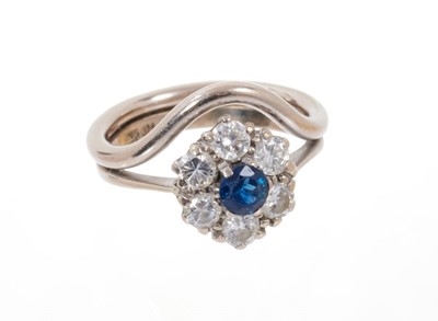 Lot 674 - Sapphire and diamond cluster ring