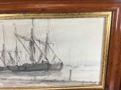 Lot 63 - Two 19th century marine watercolours - Trade ship, 20cm x 12cm, Boats at harbour 29cm x 16cm behind glass in wooden frames