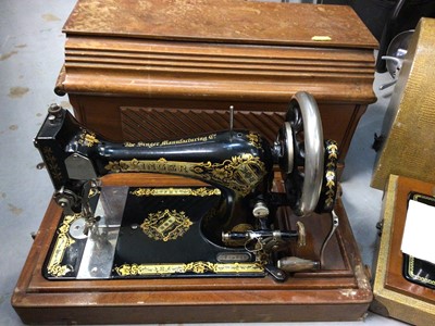 Lot 459 - Singer sewing machine in case together with a Harris sewing machine in case (2)