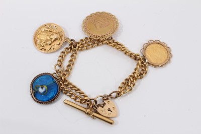 Lot 678 - Charm bracelet with half sovereign and two gold charms on yellow metal curb link bracelet