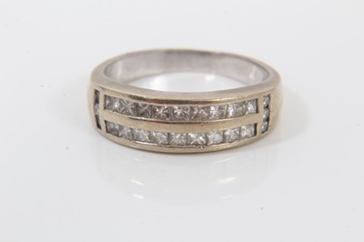 Lot 9 - 18ct white gold diamond ring with two bands of princess cut diamonds in channel setting