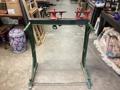 Lot 1028 - Green and red painted cast iron lathe stand