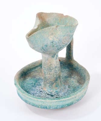 Lot 235 - Turquoise glazed faience oil lamp