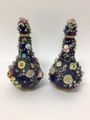 Lot 144 - Pair of 19th century floral encrusted vases and covers