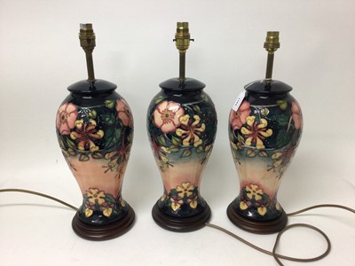 Lot 1104 - Set of three modern Moorcroft lamps