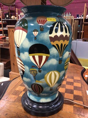 Lot 366 - Ceramic table lamp and shade, painted with hot air balloons