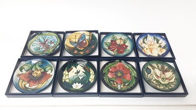 Lot 1106 - Set of eleven Moorcroft pin dishes, various patterns, all boxed