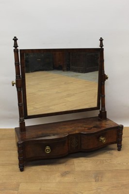 Lot 1372 - George IV mahogany and brass inlaid toilet mirror, the double serpentine front with two shaped drawers flanked by turned pilasters