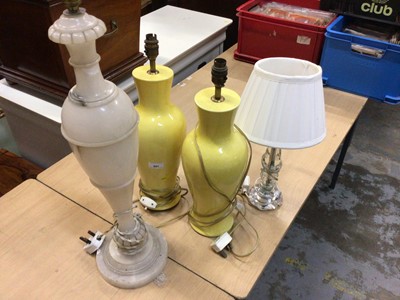 Lot 501 - Pair of yellow ceramic table lamps, one onyx and one glass table lamp (4)