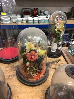 Lot 15 - Three antique glass domes (two with artificial flowers) together with two glass-domed lanterns with blue glass shell-form tops (5)