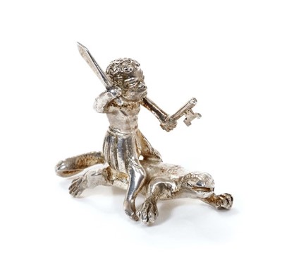 Lot 373 - Ealrly 20th century silver novelty miniature toy ornament of a negro figure on a Komodo dragon
