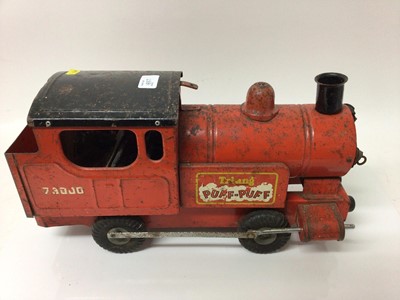 Lot 1837 - Tri-ang childs tin plate toy locomotive and a 1950s cuhilds toy lawnmower