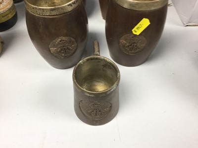 Lot 263 - Military interest- set of six turned wood tankards with carved British military badges, together with a matching jug and a smaller tankard (8)