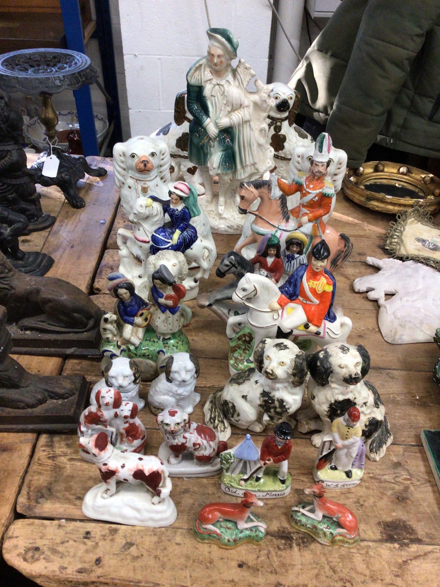 Lot 21 Collection of Staffordshire figures,