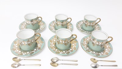 Lot 1110 - Set of six Aynsley coffee cans and saucers with green and gilt decoration with a set of six silver gilt coffee spoons (Birmingham 1974)