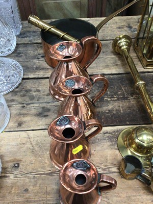 Lot 28 - Good collection of copper and brassware, including graduated jugs, oil lamps, etc