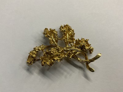 Lot 674 - Yellow metal floral spray brooch, stamped 18k