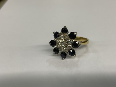 Lot 676 - Diamond and sapphire cluster ring in 18ct gold setting