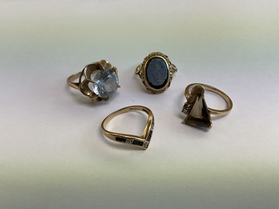 Lot 678 - Four 9ct gold and gem-set dress rings