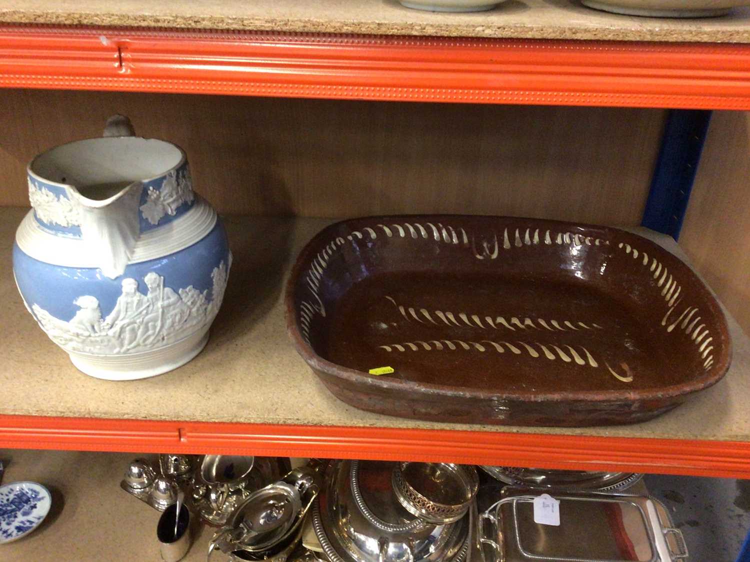 Lot 57 - Victorian slip ware baking dish with a Victorian relief moulded jug