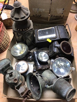 Lot 439 - Group of old carriage lanterns, vintage cycle lights, glass chimneys etc