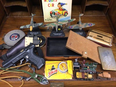 Lot 446 - Three Battle of Britain model aircrafts, toy cars and trains, cigarette cases, wallets, sling shot, 007 replica gun and sundries