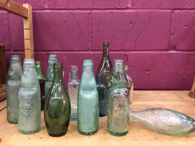 Lot 537 - Nicholl & Co, Colchester antique bottle and other vintage bottles, plus glass bells, paperweight and posy vase