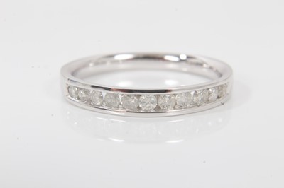 Lot 120 - Diamond eternity ring with eleven round brilliant cut diamonds, weighing 0.33cts in total, in 9ct white gold channel setting