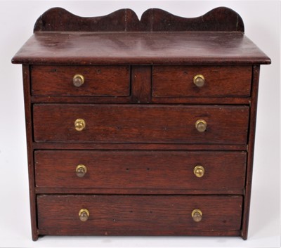 Lot 837 - 19th century oak miniature chest of drawers with ledge back and brass bun handles