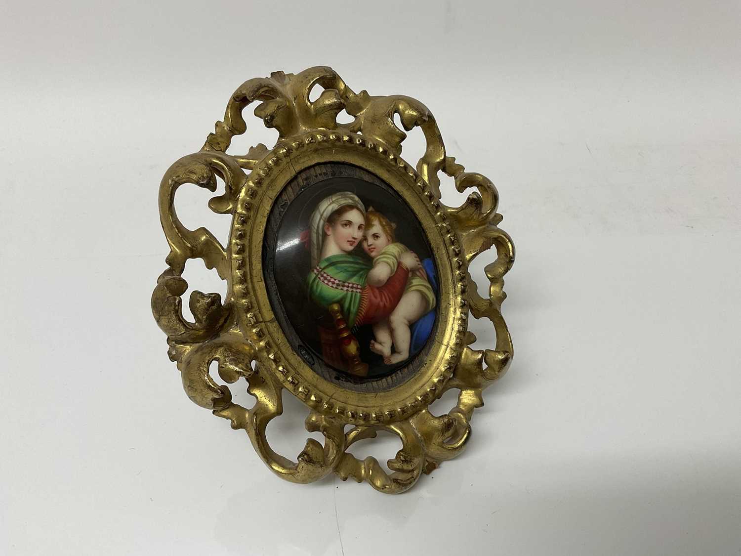 Lot 91 - 19th century Italian porcelain plaque depicting the Madonna & Child in giltwood frame