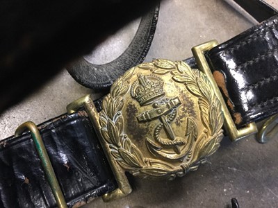 Lot 323 - Second World War Royal Navy black sword belt by Gieves Limited, together with another unnamed. (2)