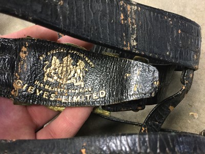 Lot 323 - Second World War Royal Navy black sword belt by Gieves Limited, together with another unnamed. (2)