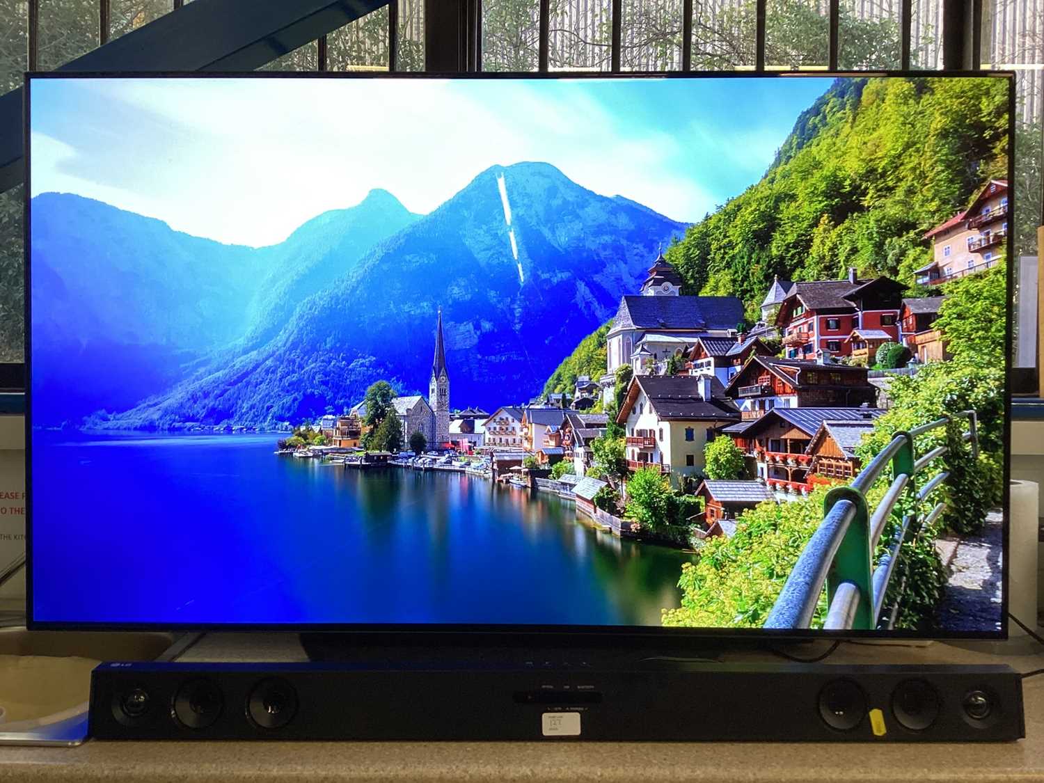 Lot 127 - LG OLED flatscreen smart television, model number OLED55B9PLA with remote control, together with an LG sound bar model number SK1D