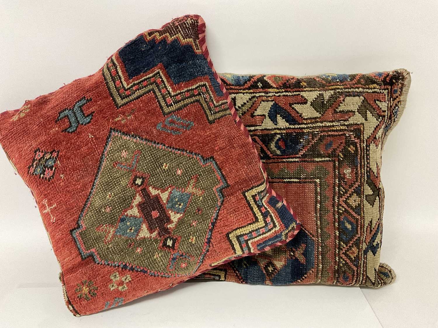 Lot 111 - Pair of square cushions utilising sections of antique Persian rugs
