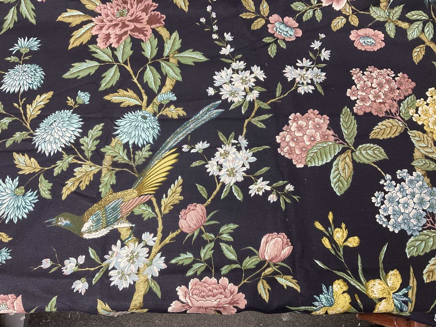 Lot 112 - Two boxes of textiles to include Sanderson 'Bird and Peony' pattern fabric, gentlemen's black bowler hat, pair of curtains, silk scarves etc