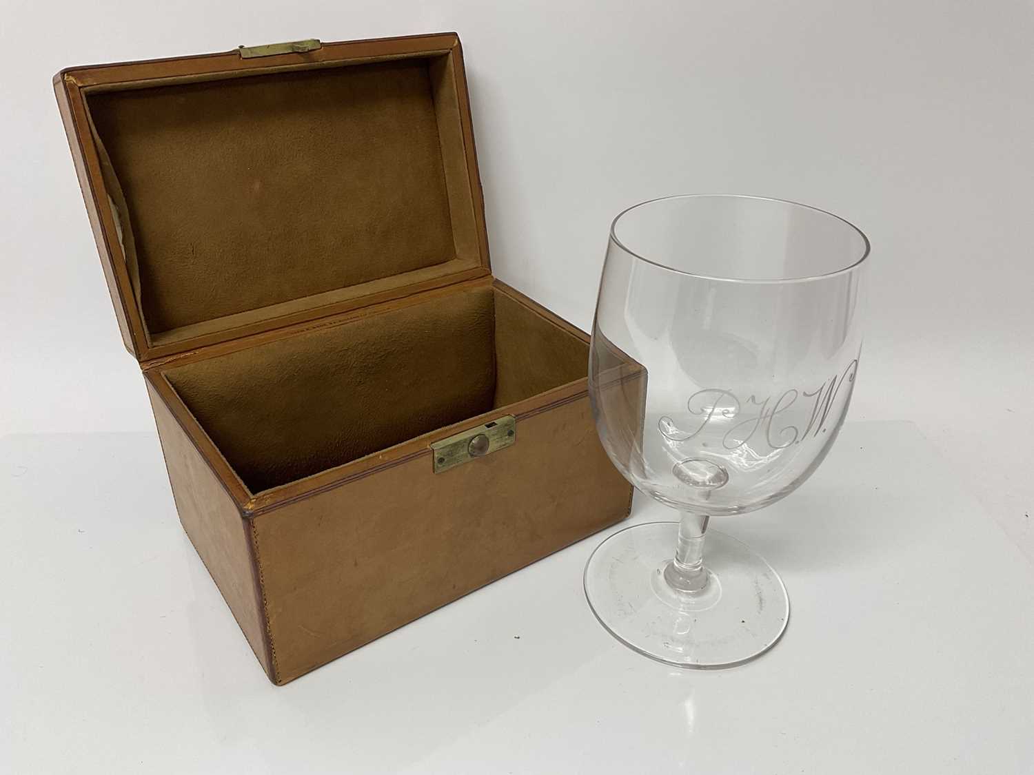 Lot 114 - Drew & Sons brown leather case containing a good quality glass goblet with engraved initials, P.H.W.
