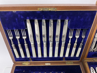 Lot 115 - Two sets of Edwardian twelve place setting silver plated fruit cutlery in original fitted cases