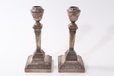 Lot 389 - Pair of Edwardian silver candlesticks