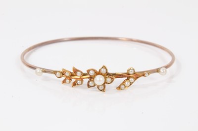 Lot 116 - Victorian yellow metal seed pearl bangle with floral decoration, boxed
