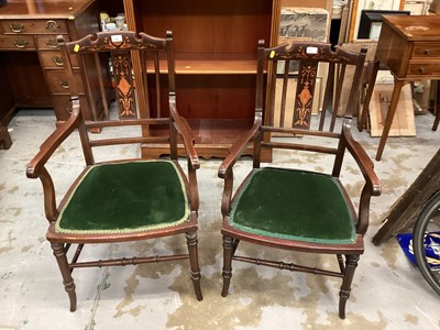 Lot 986 - Two Edwardian inlaid mahogany elbow chairs with green padded seats