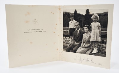Lot 68 - H.M. Queen Elizabeth II signed 1955 Christmas card with gilt crown to cover, photograph of the Royal couple with their children, signed 'Elizabeth R 1955' with envelope.