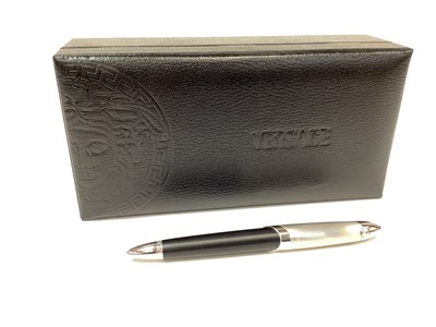 Lot 2536 - Versace ballpoint pen in box, together with a silver mounted cheese knife in box (2)