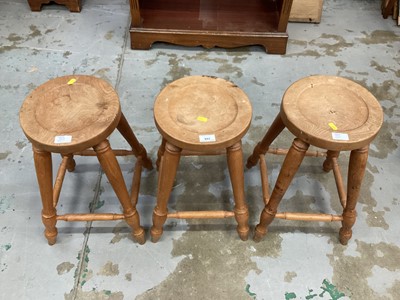 Lot 992 - Three Russell Thomas stools, together with one other smaller stool (4)