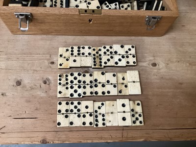Lot 121 - Collection of antique bone and ebony dominoes
