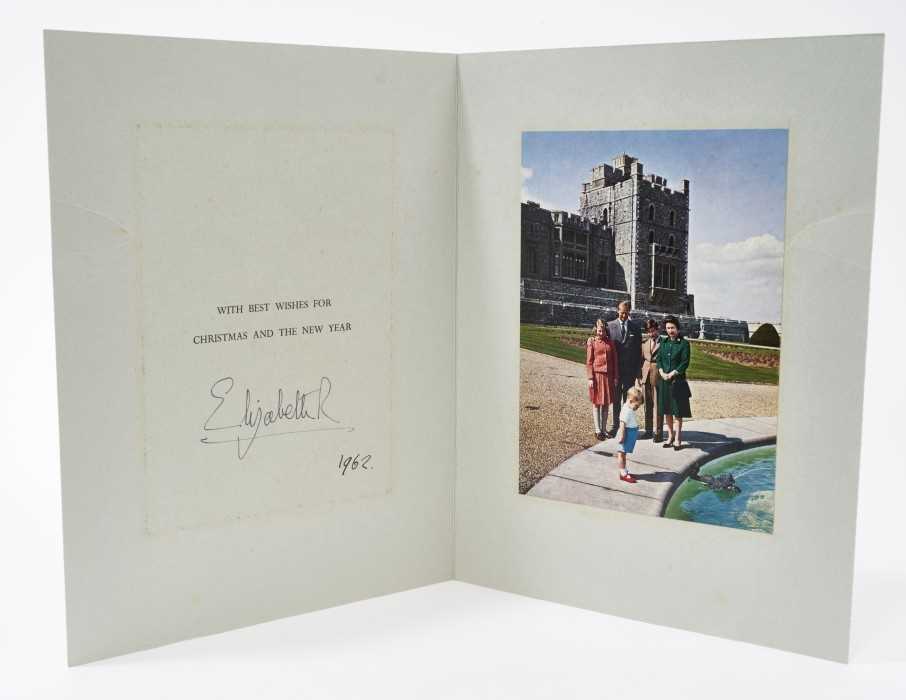 Lot 75 - H.M.Queen Elizabeth II signed 1962 Christmas card with twin Gilt ciphers to cover, colour photograph of the Royal Family at Windsor, signed 'ElizabethR 1962', with envelope